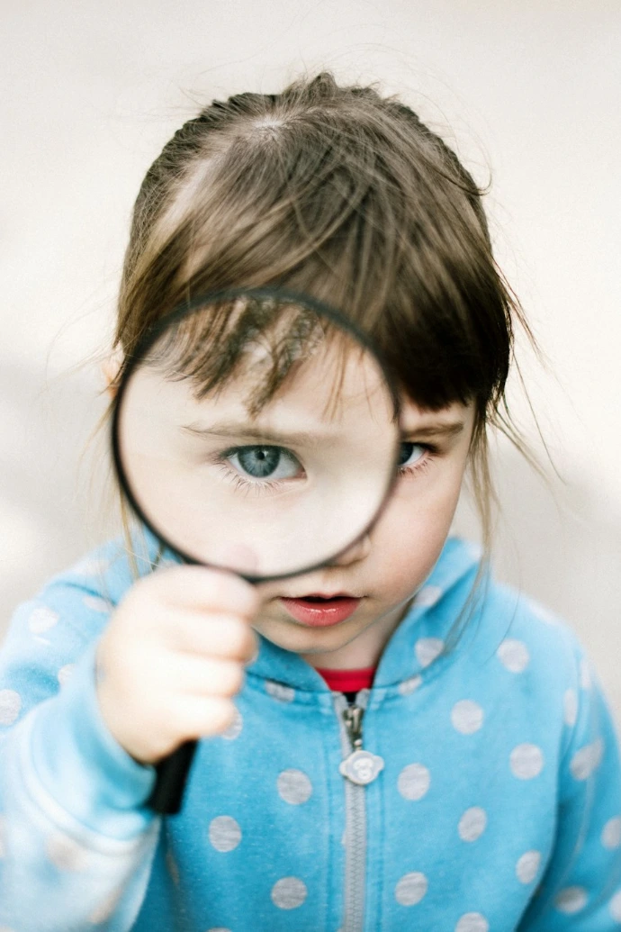 girl in blue and white polka dot jacket